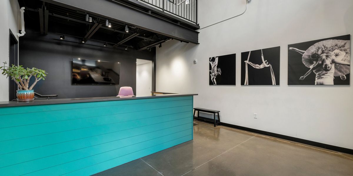 A railed studio loft above of the main studio area in Springs Dance West