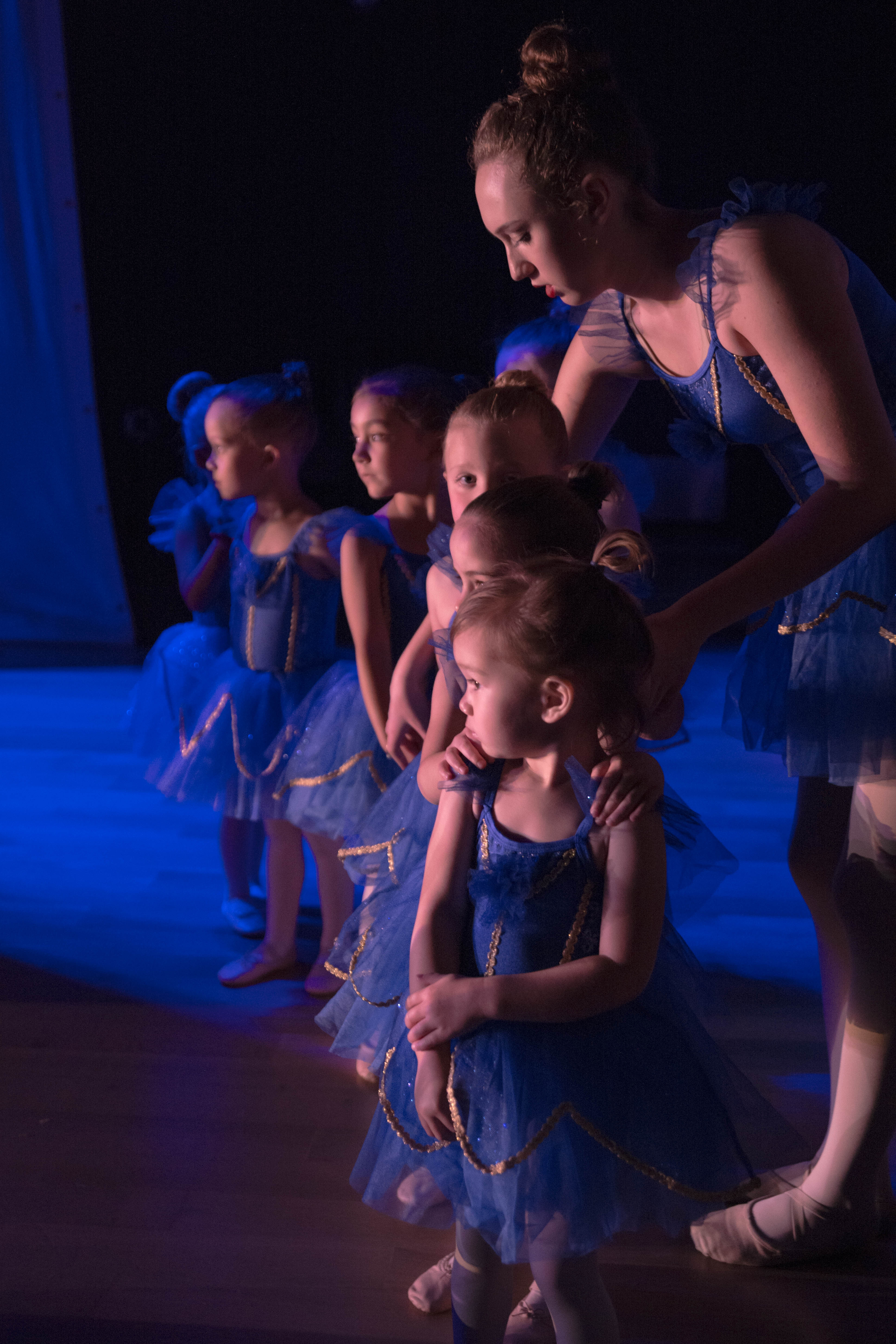Pre-School dancers following rules about being quiet behind stage at the recital