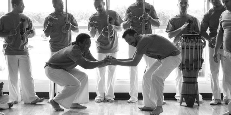 People bonding through Capoeira in the Roda