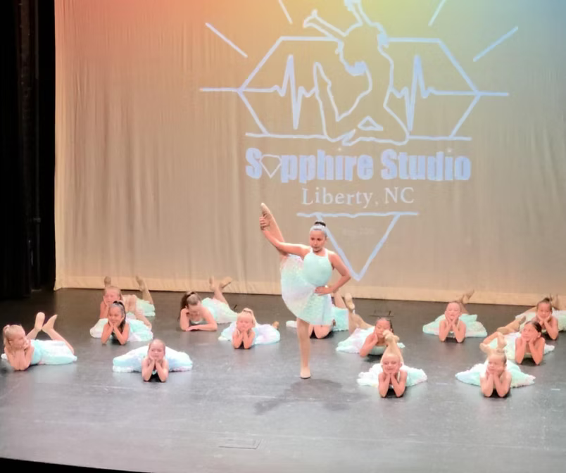 Young dancers performing on stage at the recital