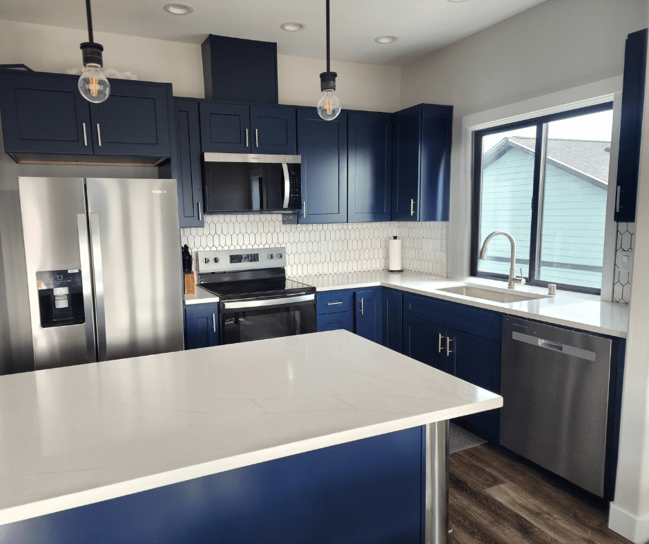 The open kitchen with dishwasher and full-size fridge.