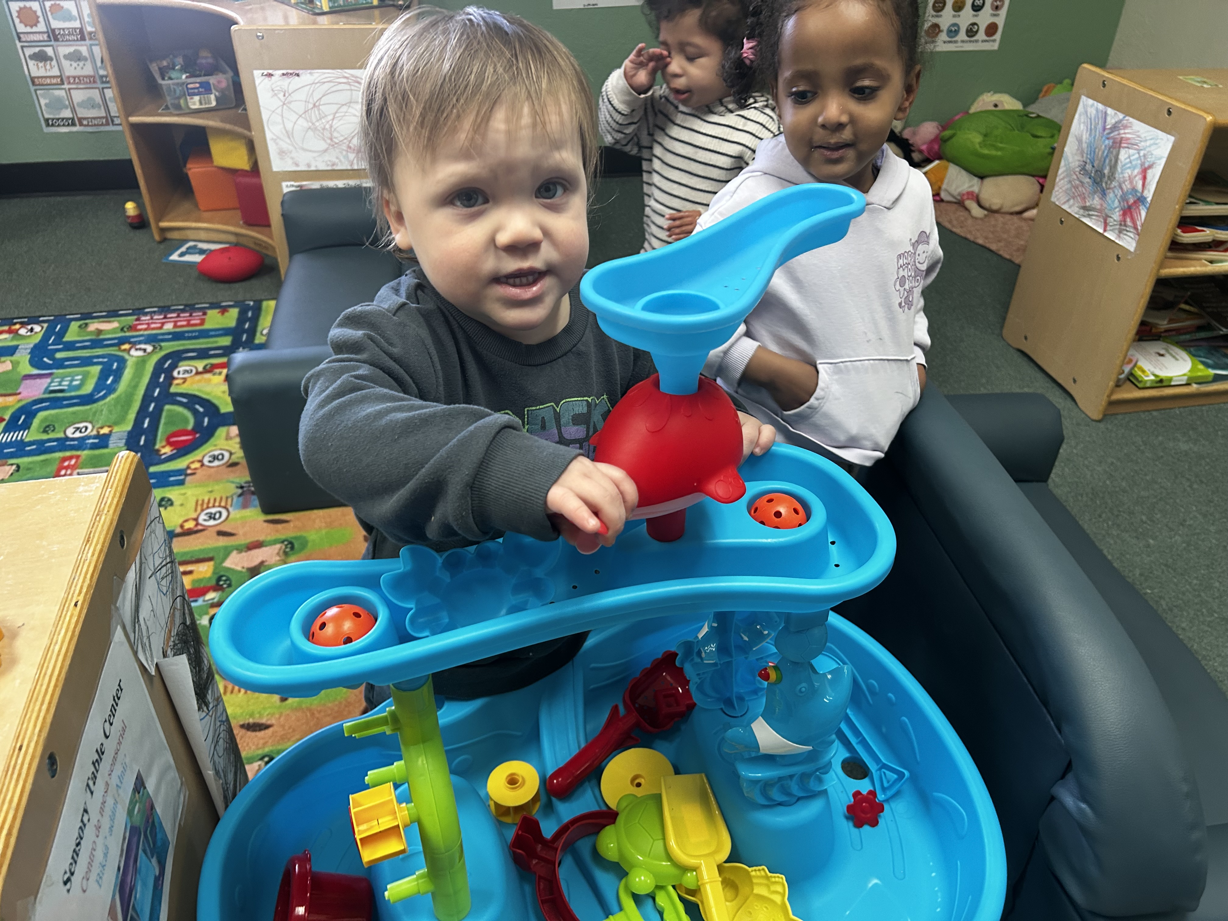 Toddlers playing in classroom
